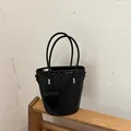 Elegant black woven bucket bag for women with dual top handles for stylish summer commuting - Black