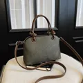 Elegant green textured women's crossbody bag with brown knotted handles and strap - No Pendant / Gray