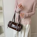 Elegant vintage brown cylinder underarm bag for women with minimalist retro design - Coffee