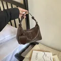 Brown woven hobo handbag for women, elegant dumpling shoulder bag in summer fashion style - Coffee