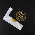 Elegantes Set aus schwarzer Grußkarte und weißem Umschlag mit goldener Best Wishes Folienprägung - Sternring Wunsch