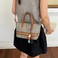 Elegant hollow-out woven crossbody bag for women featuring a stylish colorful bead charm - Beaded Pendant Style / Brown with Pendant