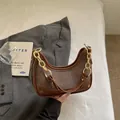 Chic brown crescent handbag with gold chain strap and textured fabric contrast. - No Pendant / Brown