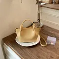 Elegant pale yellow textured faux leather bucket bag with knotted top handle for women - Standard Type / Yellow