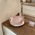 Chic pink bucket handbag with crinkled texture and adjustable shoulder strap - Standard Type / Pink