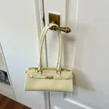 Minimalist cream yellow faux leather underarm tote bag with gold buckle detail - Basic Style / Yellow