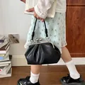 Vintage black pleated shell handbag with ruched faux leather finish and metal clasp - Black