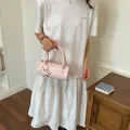 Stylish pink woven barrel handbag with star charm detail for women - Pink