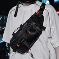 Black tactical crossbody chest bag with adjustable straps and urban techwear style - Black