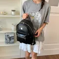 Stylish black woven-texture backpack for women, ideal for casual and commute use - Black (Without Charm) / Black