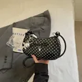 Chic black polka dot underarm bag with decorative bow and silver rabbit charm details. - With Pendant / Black