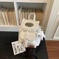 Charming cream white vintage mini backpack for women featuring delicate lace trim and star charm - Off White