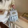 Elegant light blue mini backpack with vintage lace trim and cute star charm detail - Blue