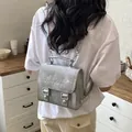 Chic silver mini backpack for women featuring delicate heart embroidery and stars - Silver