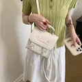 Stylish white mini backpack with pink heart embroidery and adjustable shoulder straps. - Off White