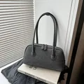 Stylish grey felt Boston bag with large capacity for versatile shoulder or hand carry. - Black