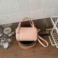 Elegant light pink cylinder pillow handbag with top handles and adjustable strap - Standard Type / Pink