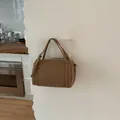 Elegant khaki leather cylindrical pillow handbag with adjustable straps and silver hardware - Standard Type / Khaki