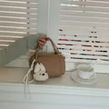 Chic small khaki barrel handbag for women featuring a cute white plush dog charm decoration - With Pendant / Khaki