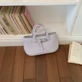 Elegant lavender textured leather handbag for women, chic commuter style top-handle bag - Purple