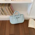 Stylish light blue textured leather top-handle bag with buckle detail - Blue
