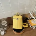 Vibrant yellow mini crossbody phone bag with adjustable strap and silver zipper closure - Yellow With Pendant
