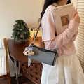 Fashionable gray cylindrical crossbody bag with a cute plush dog charm accessory - Standard Type / Blue