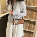 Stylish brown cylinder crossbody bag for women with a cute bear plush charm accessory - Standard Type / Brown