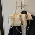 Large cream canvas tote bag with adjustable strap and colorful bead charm detail - With Pendant / Off White