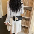 Trendy black cylindrical crossbody bag for women featuring a cute teddy bear charm - With Bear Pendant / Black