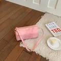 Minimalist pink barrel crossbody bag with soft suede texture for summer fashion - Pink
