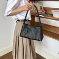 Elegant black woven underarm bag for women, perfect for stylish daily commuting and office wear. - Black