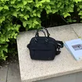 Compact black outdoor crossbody bag with decorative rope handles for women. - Small Black