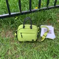 Small lime green outdoor crossbody bag with black rope handles and adjustable strap - Green Small