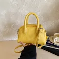 Stylish yellow mini Boston bag with adjustable strap for women's crossbody wear - Yellow