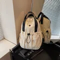 Lightweight cream nylon multi-functional backpack for women with drawstring pocket. - White