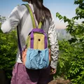 Multifunctional colorful lightweight outdoor backpack for women in hiking scene setting - Colorful