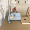 Elegant light blue quilted leather handbag with cute poodle charm and chain strap - With Pendant / Blue