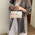 Elegant white quilted small square crossbody bag with a cute teddy bear charm for women - With Pendant / White