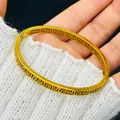 Close-up of 18k gold plated bracelet with intricate Greek key pattern detail. - Hollow Meander Style (4119) / Gold