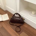 Fashionable dark brown glossy mini Boston handbag with top handles and shoulder strap - Without Pendant / Coffee