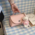 Vintage pink pebbled leather small crossbody bag featuring a cute teddy bear charm - With Pendant / Pink