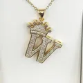 Detailed close-up of gold crown letter W pendant encrusted with sparkling zircons - Letter W / Gold
