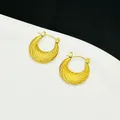 Macro detail of textured 18K gold plated stainless steel French hoop earrings - Textured Wave Hoop Style (7767)