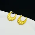 Close-up detail of French style 18K gold plated stainless steel croissant hoop earrings. - Croissant Ribbed Style (7768)