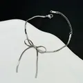 Elegante zilveren roestvrijstalen strikarmband met lange lintkwastjes en verstelbare ketting - Zilveren Strik Slangenketting Armband (5382)