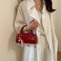 Exquisite red patent leather pillow bag with cute heart charm for stylish women - With Charm / Red