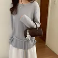 Elegant dark brown glossy pillow bag with a decorative white charm and top handle strap - With Charm / Coffee