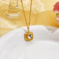 Macro detail of French vintage 18k gold plated titanium steel square pendant necklace - White Glass Stone Necklace (EH156) / Gold