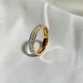Close-up of elegant double-row crystal eternity ring resting on white silk fabric - 5 / Rose Gold